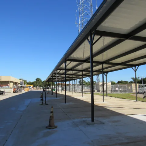 Covered outdoor structure with exposed framing and posts